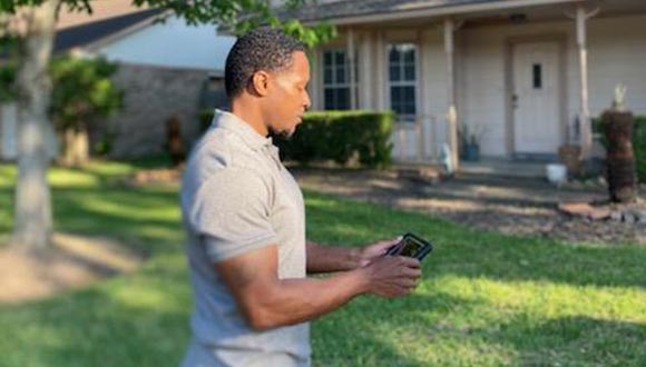 Matthew West, from OMNI Property Inspections, reviewing a home inspection report.